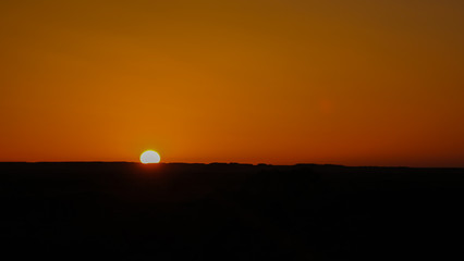 Sunrise at sandstone formation in the Sahara desert near Yoa Lake group of Ounianga Kebir, Ennedi, Chad