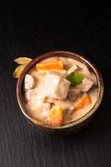 Classic French food concept Blanquette de Veau or Veal in White Wine Sauce in handmade ceramic cup with copy space