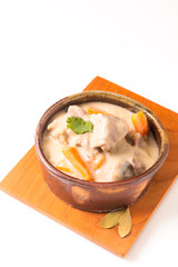 Classic French food concept Blanquette de Veau or Veal in White Wine Sauce in handmade ceramic cup with copy space