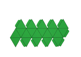 Geometric shape cut out of paper and photographed on white background. Geometry net of platonic...