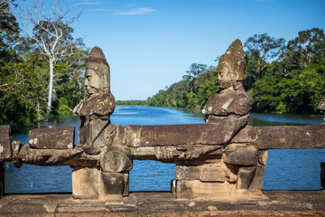 Head sculptures on the bridge leading to the south gate at Angkor Thom temple complex, Siem Reap, Cambodia
