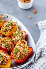 Close-up of bell peppers stuffed with quinoa. Diet concept of healthy vegetarian food.