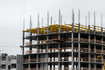 Building construction on monolithic technology. Construction of the building. Concrete frame of the building.