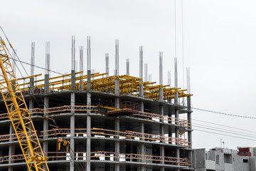 Building construction on monolithic technology. Construction of the building. Concrete frame of the building.