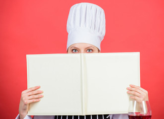 Woman study culinary. Culinary expert. Chef cooking healthy food. Cooking techniques. Cook read book best culinary recipes. Culinary school concept. Book by famous chef copy space. Professional level