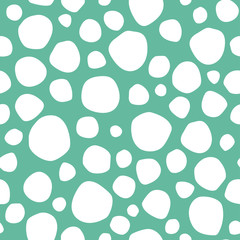 Seamless abstract pattern with white shabby spots on turquoise background.