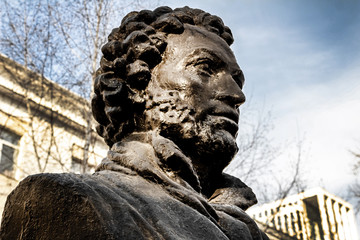 UFA, RUSSIA - 11 APRIL 2019: close-up bust of the Alexandr Sergeevich Pushkin against the sky, greatest russian poet