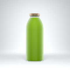 Tall transparent glass bottle filled by vegetable juice on the white background.