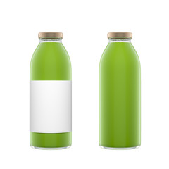 Two tall transparent glass bottles with label filled by vegetable juice isolated over white background.