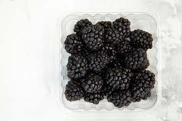 blackberries on the table, Rustic on blue backdrop.