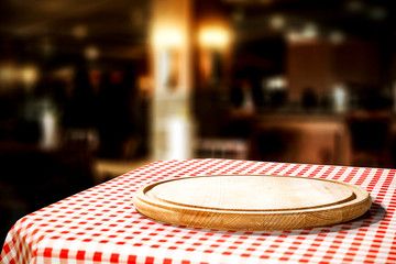 White and red tablecloth with kitchen desk and free space for your decoration. Restaurant interior 
