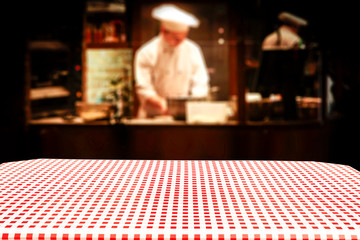 Table background of free space in restaurant interior and cook chef. 