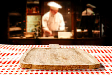 Table background of free space in restaurant interior and cook chef. 