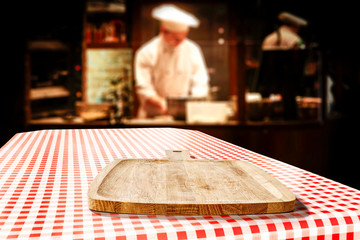 Table background of free space in restaurant interior and cook chef. 