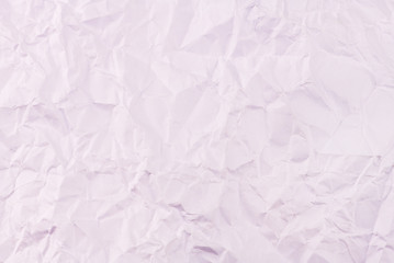 Pink crumpled paper texture background.
