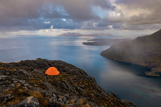Wild camping on the top of Sgurr Na Stri on the Isle of Skye with views towards the Isle of Soay, Isle of Skye, Inner Hebrides, Scottish Highlands, Scotland