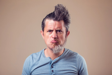 A portrait of man with half beard and hair