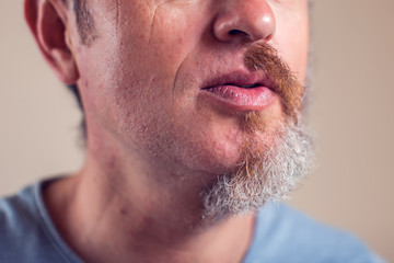 Obraz premium A portrait of man with half beard and hair