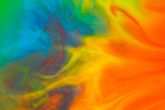 Fluid acrylic paint background, abstract texture. Colorful mix of acrylic vibrant colors.