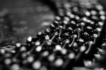 Shiny metal chains on stone background