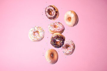 Spinkle Donuts on Colorful Background