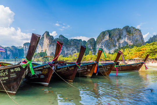 Long tail boats and karst scenery on Railay beach in Railay, Ao Nang, Krabi Province
