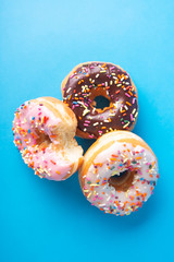 Spinkle Donuts on Colorful Background