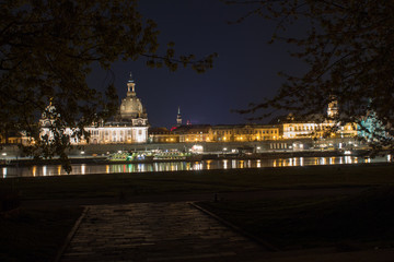 Fototapeta na wymiar Streets and lights, reflection and shine of the night city of Dresden, Germany.