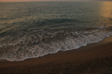 empty sand beach in Aegean sea waterfront district in evening sunset romantic time 