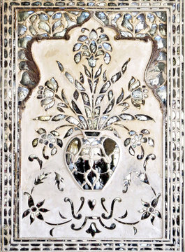 Mirror mosaic on the wall of the ancient palace Sheesh Mahal XVII century in the old Amber Fort, Jaipur, India