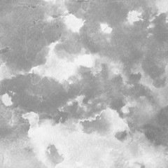 Silver with gray ink and watercolor texture on white paper background. Paint leaks and ombre effects. Hand painted abstract image.