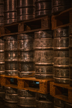 shining aluminum beer barrels stacked in a brewery