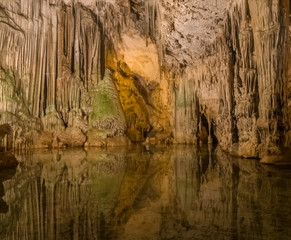Neptune's Grotto (Grotta di Nettuno) a natural stalactite cave near Alghero , Sardinia, Italy. Accessible when the waters are calm by a steep stairway cut into the cliff or by boat from Alghero..