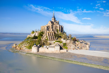 The famous of top view with blue sky at Mont-Saint-Michel, Normandy, France - obrazy, fototapety, plakaty