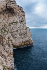 Capo Caccia, a rocky outcrop set in a protected ecosystem near the town of Alghero, Sardinia, Italy. featuring. Scenic hiking routes, diving sites & caverns with archaeological remains