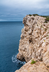 Capo Caccia, a rocky outcrop set in a protected ecosystem near the town of Alghero, Sardinia, Italy. featuring. Scenic hiking routes, diving sites & caverns with archaeological remains
