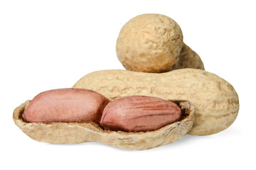 A small pile of peanuts on a white isolated background. Close-up. Macro. Side view.
