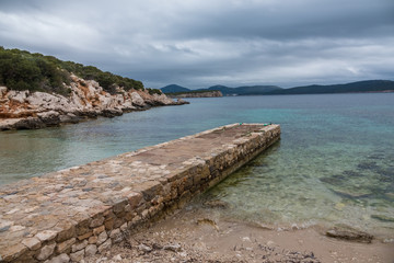 Capo Caccia nature reserve, a rocky outcrop set in a protected ecosystem near the town of Alghero, Sardinia, Italy. featuring. Scenic hiking routes, diving sites & caverns with archaeological remains
