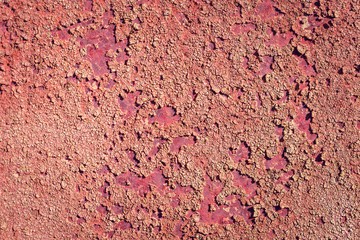 Old rusted metal sheet with peeling off layers of textured rust background with copy space