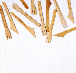 Collection of Eco friendly bamboo cutlery on white background, flat lay, top view, copy space