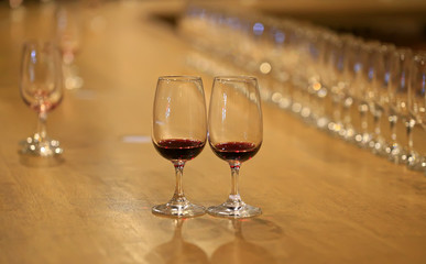 A glass of red wine is on the table