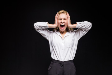 Young attractive businesswoman, surprised by something isolated on black background