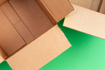 Empty open cardboard boxes on blue background