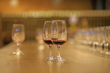 A glass of red wine is on the table