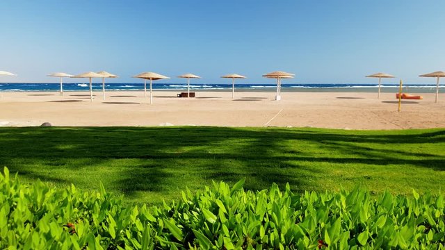 4k video of revealing beautiful empty sea beach at hot sunny day