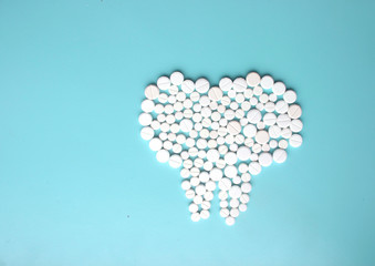 Tooth made of pills. Dental clinic concept.
