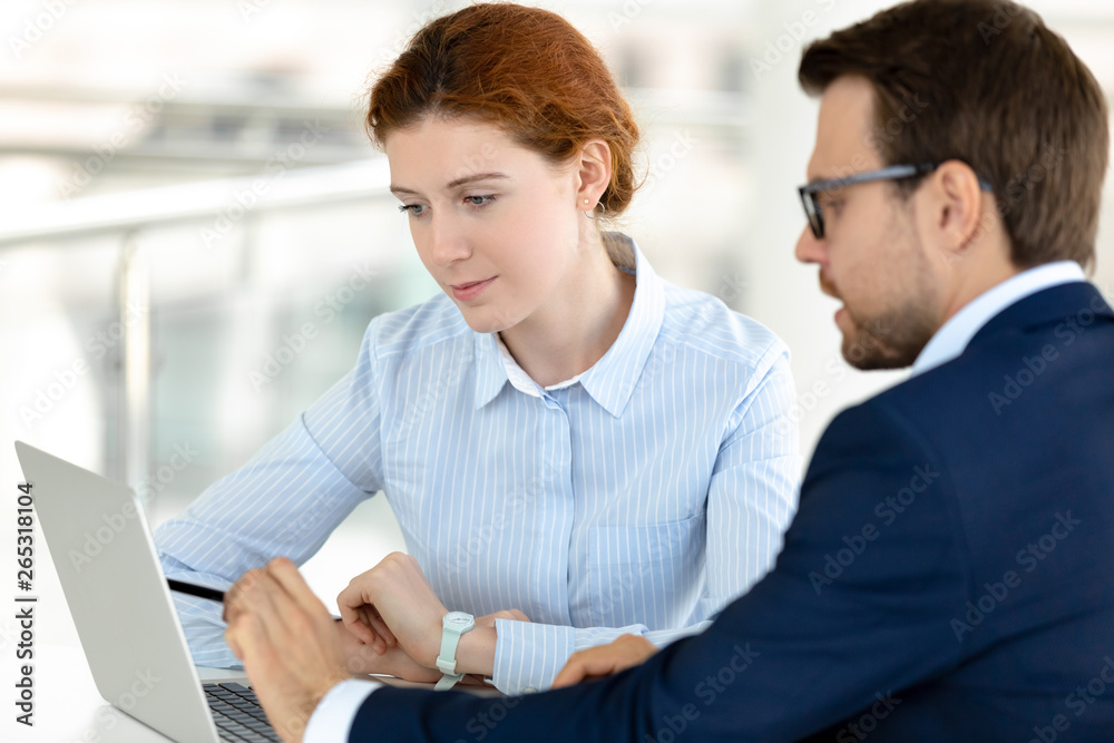 Poster сlient intern listening to broker mentor consulting pointing at laptop