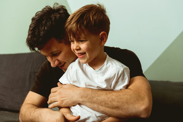 Father hugging his son