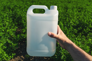 Pesticide jug mock up in clover field