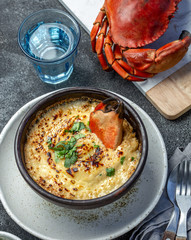  CHILEAN FOOD.  Baked crabmeat crab meat with cheese, cream and bread.  Traditional dish of chilean coast. Pastel o chupe de jaiba.